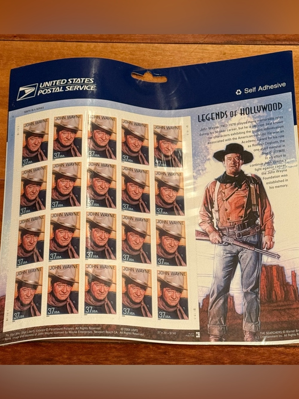 John Wayne 37cent US postal stamps. Sheet of 20 stamps. Packaging has warped